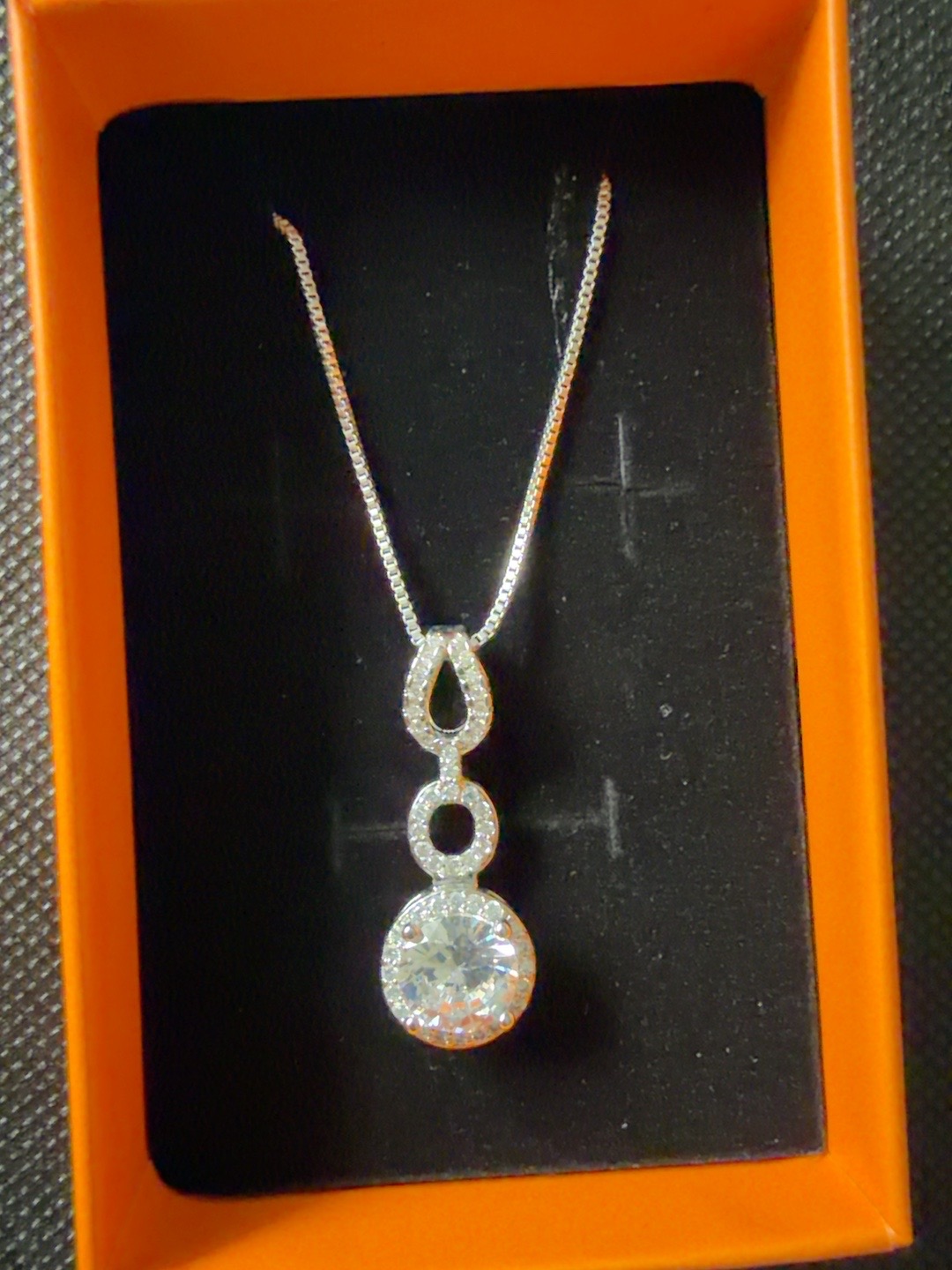Moissanite drop pendant necklace in orange gift box, front view